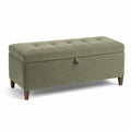 Banc de velours vert avec espace de rangement et pieds en bois